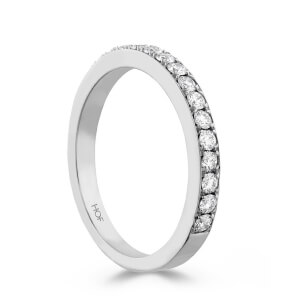 A white gold wedding band with round diamonds.