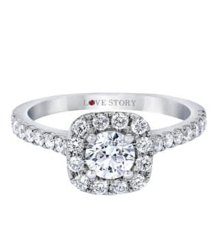 A white gold halo engagement ring with diamonds.