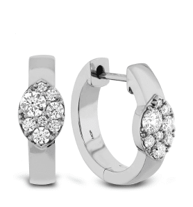 A pair of white gold diamond hoop earrings.