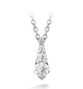 A diamond pendant with three stones on a chain.