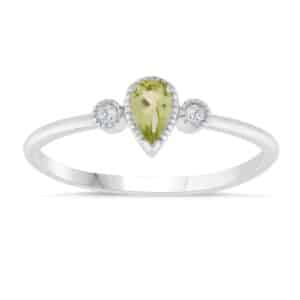 A pear shaped peridot and diamond ring.