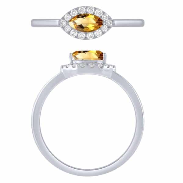 A white gold ring with a citrine stone and diamonds.