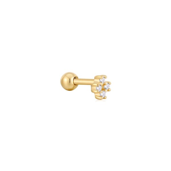 A gold plated piercing with white diamonds.
