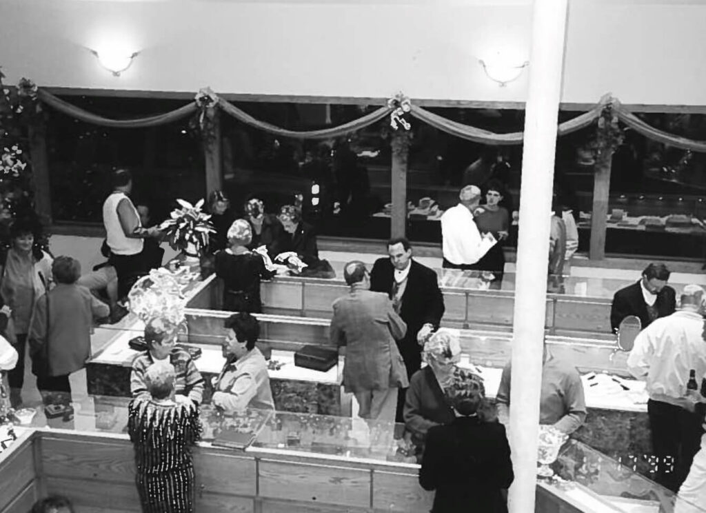 Shoppers and sales associates in the Necker's Jewelers in DeWitt in 1999