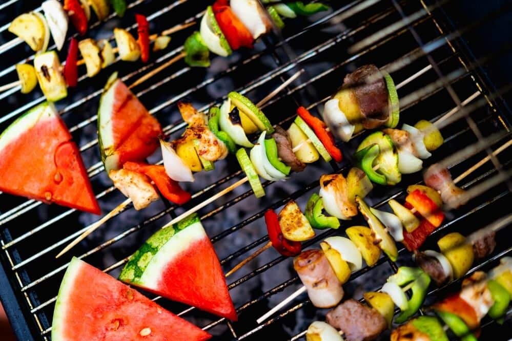 Watermelon and kabobs on a grill