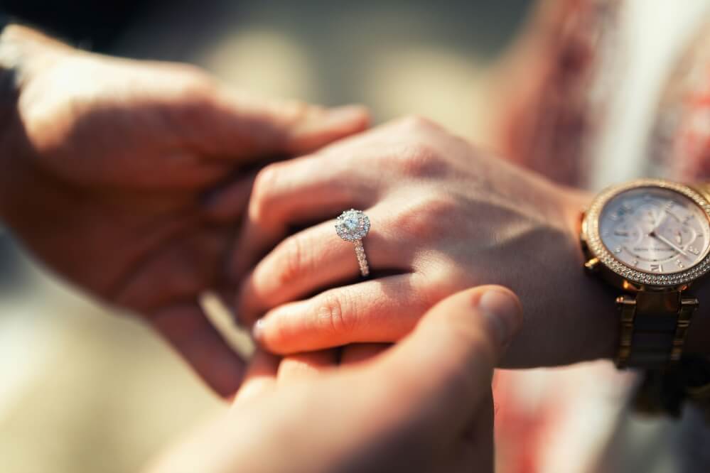 Diamond halo engagement ring.