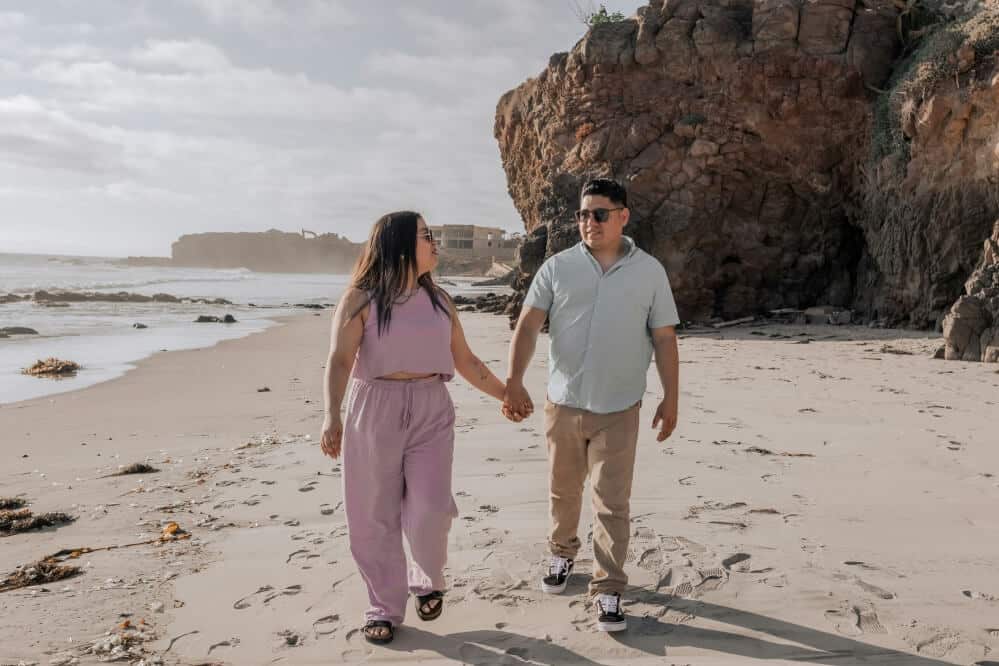 Man and woman walking on the beach