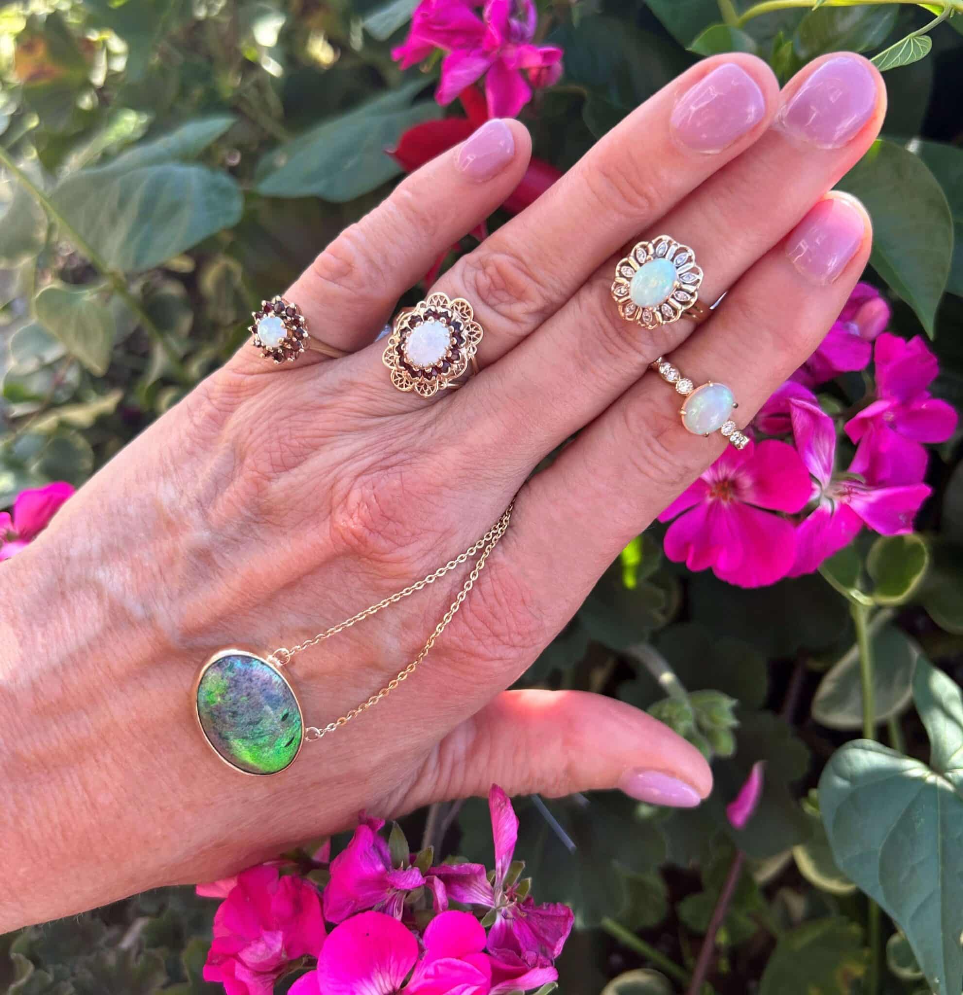 4 opal rings and 1 opal necklace