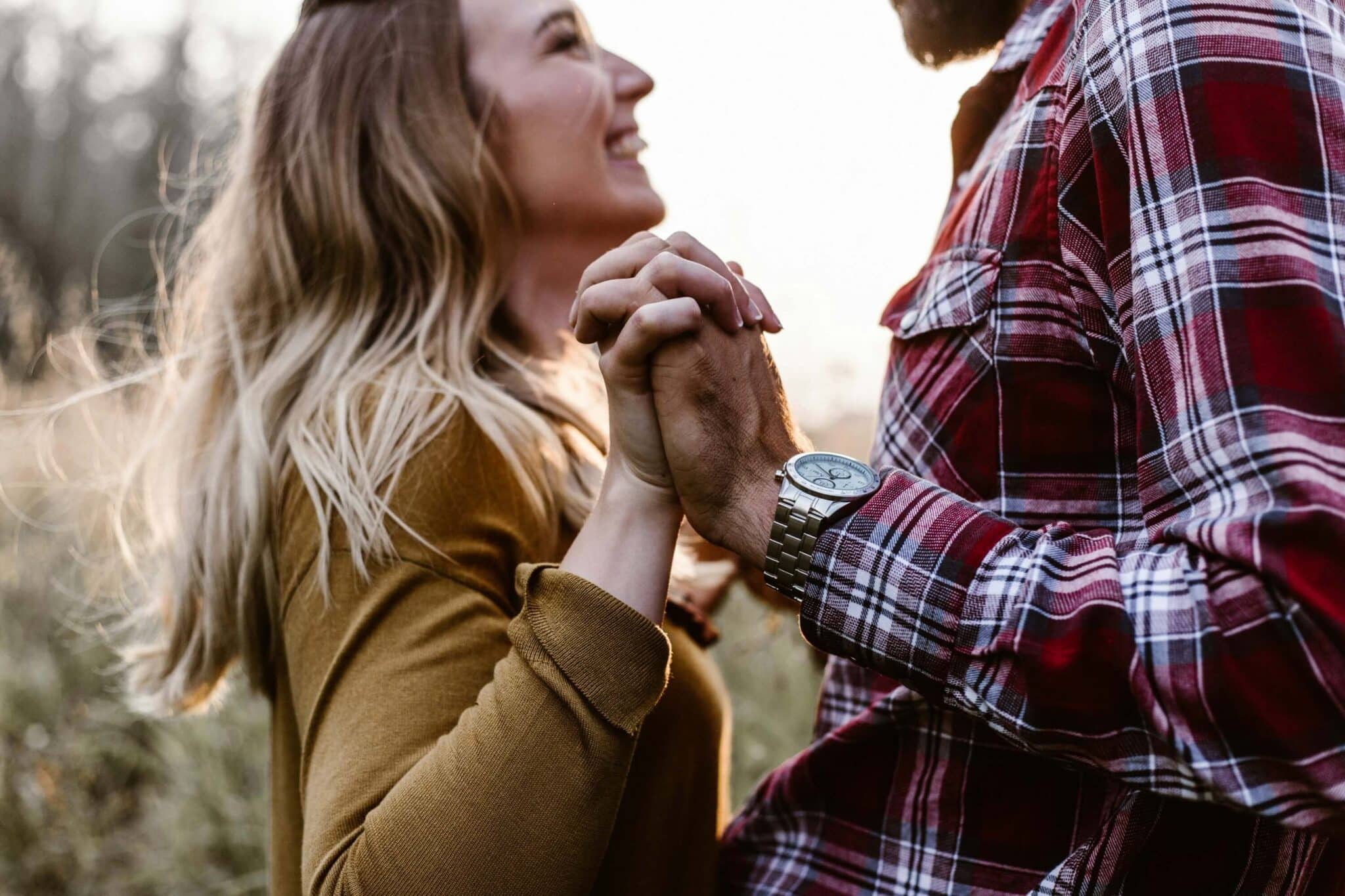 Man and woman holding hands